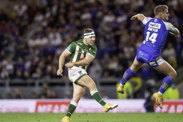 Game over: Warrington's George Williams kicks the game- winning drop goal against Leeds. Picture by Allan McKenzie/SWpix.com