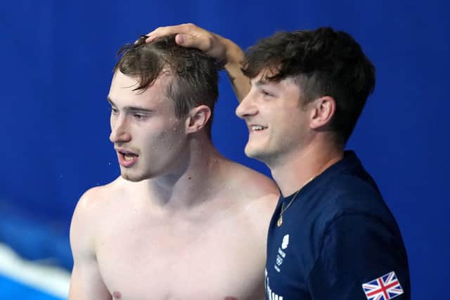 ON IT: Jack Laugher (left) and coach Adam Smallwood react after the Harrogate diver won bronze in the Men's 3m Springboard Final at Tokyo Aquatics Centre. Picture: Martin Rickett/PA