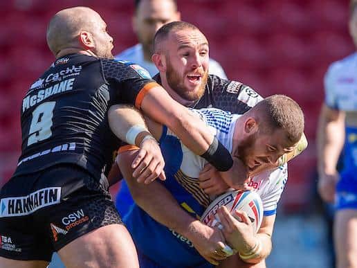 Leeds' Cameron Smith is tackled by Castleford's Daniel Smith during the sides' meeting in April. Picture by Allan McKenzie/SWpix.com.