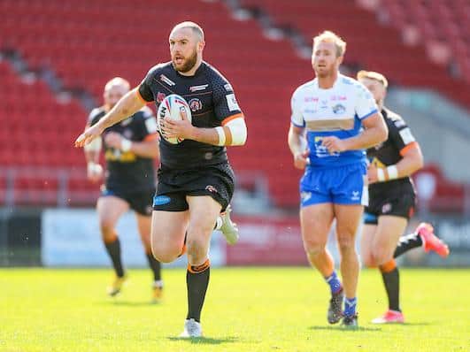 Daniel Smith makes a break during Tigers' win over Rhinos in April. Picture by Allan McKenzie/SWpix.com.