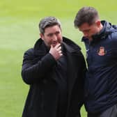 Sunderland head coach Lee Johnson (left) with Andrew Taylor (right). Pic: PA