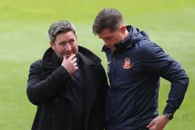Sunderland head coach Lee Johnson (left) with Andrew Taylor (right). Pic: PA
