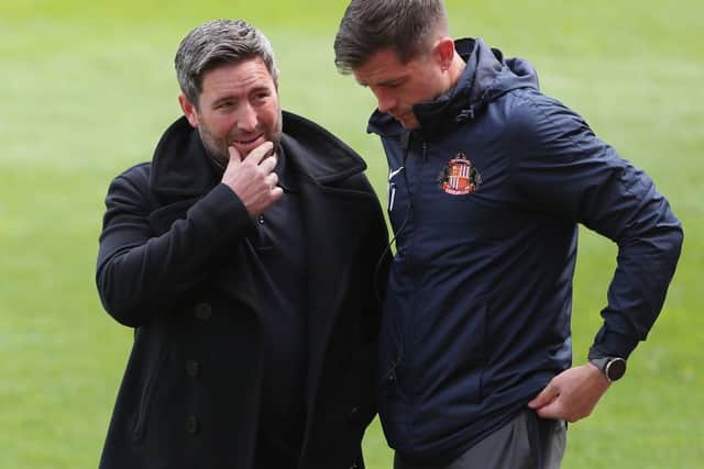 Sunderland head coach Lee Johnson (left) with Andrew Taylor (right). Pic: PA