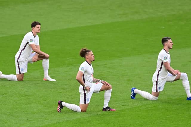 TOGETHER: Leeds United's Kalvin Phillips, centre, takes the knee alongside England team mates Harry Maguire, left, and Declan Rice, right, before the Three Lions take on Czech Republic at Euro 2020. Photo by NEIL HALL/POOL/AFP via Getty Images.