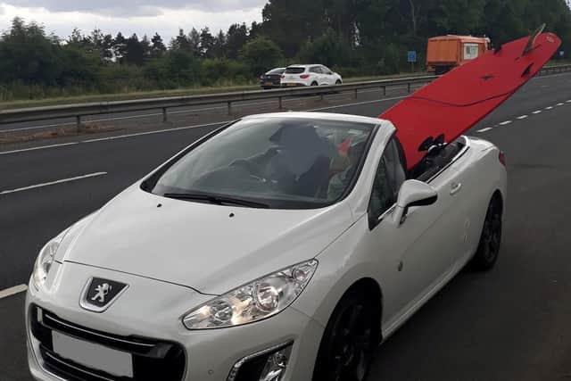 The method of transporting the surfboard was described as "extremely dangerous" by police