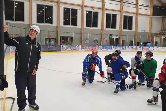 Dam Zajac, third from right, and his Leeds Knights' team-mates listen to instruction during Monday night's practice from head coach Dave Whistle.
