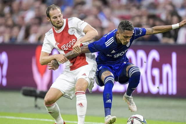 WELL HELD: Ajax's Dutch defender Daley Blind, left. keeps Leeds United winger Raphinha in check during Wednesday evening's pre-season friendly in Amsterdam. Photo by GERRIT VAN KEULEN/ANP/AFP via Getty Images.