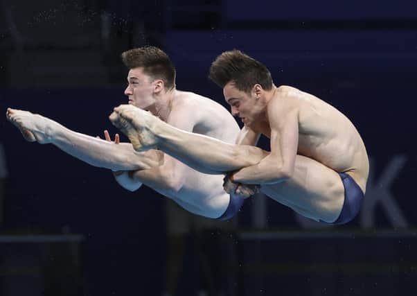 Tom Daley and Matty Lee dive their way to gold in the Men's Synchronised 10m Platform Final at Tokyo Aquatics Centre. Picture: Jean Catuffe/Getty Images
