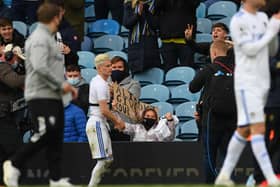 A young fan smiles after Ezgjan Alioski gives her his shirt after the Premier League clash against West Bromwich Albion at Elland Road in May 2021. PIC: Getty
