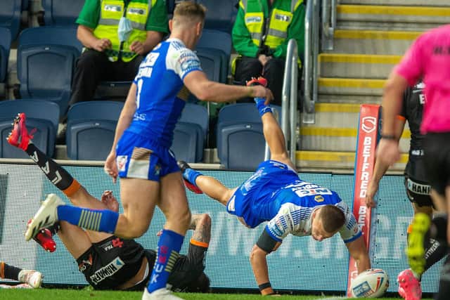 In the corner: Captain Ash Handley scores the Rhinos second try.
Picture Bruce Rollinson