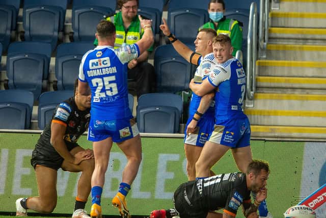 Captain's salute: Ash Handley celebrates after scoring the Rhinos second try against Cas. Picture Bruce Rollinson