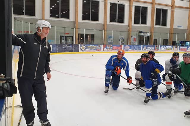 Dave Whistle gives instruction to his Leeds Knights players during last week's practice session at the team's Elland Road rink.