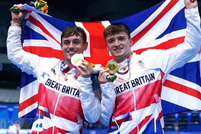 Leeds' Matty Lee and partner Tom Daley celebrate winning gold in the Men's Synchronised 10m Platform Final at the Tokyo Aquatics Centre.