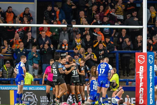 Tigers celebrateGreg Eden's second try in the win at Leeds. Picture by Bruce Rollinson.