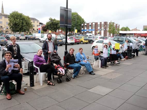 Residents and shoppers held a sit-in protest at Bramley Shopping Centre this weekend urging the centre owners to reinstall all of the benches. Photo: Philip McConnell
