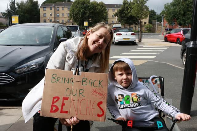 Campaigners took their own chairs to the centre to hold the protest. Photo: Philip McConnell