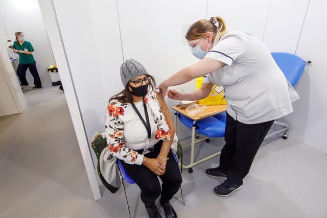 A woman receives a Covid vaccine at the Elland Road vaccine centre (Photo: PA Wire/Danny Lawson)