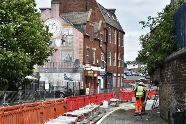 Mabgate is currently going through a regeneration. Pictured: Council roadworks next to the Janet De Wagt mural, commissioned in 1987.