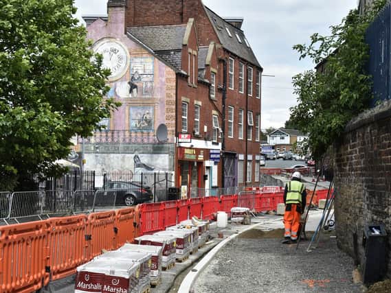 Mabgate is currently going through a regeneration. Pictured: Council roadworks next to the Janet De Wagt mural, commissioned in 1987.