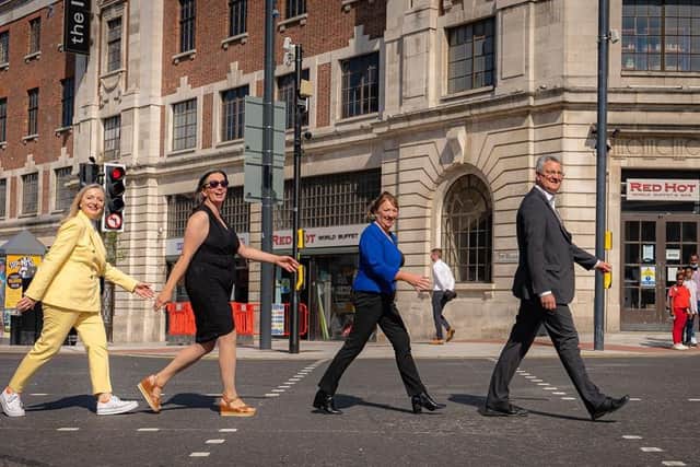 Mayor of West Yorkshire Tracy Brabin, Coun Helen Hayden, Coun Kim Groves and Leeds City Council leader James Lewis test out a new pedestrian crossing on the Headrow.
