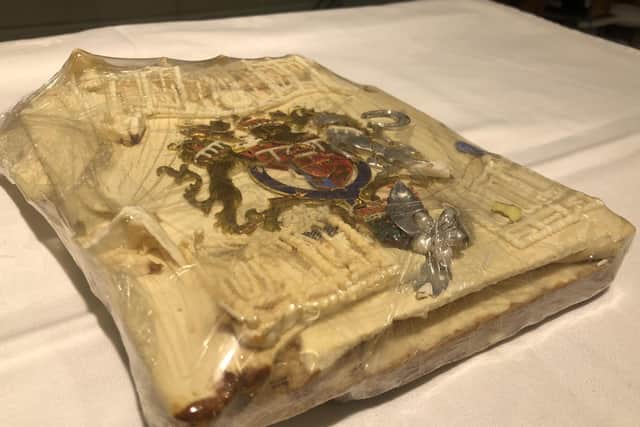 The slice of cake from one of the 23 official wedding cakes made for the Royal Wedding of HRH Prince Charles and Lady Diana Spencer (photo: PA).
