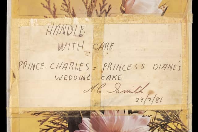 Undated handout photo issued by Dominic Winter Auctioneers of a tin containing a slice of cake from one of the 23 official wedding cakes made for the Royal Wedding of HRH Prince Charles and Lady Diana Spencer (photo: PA).