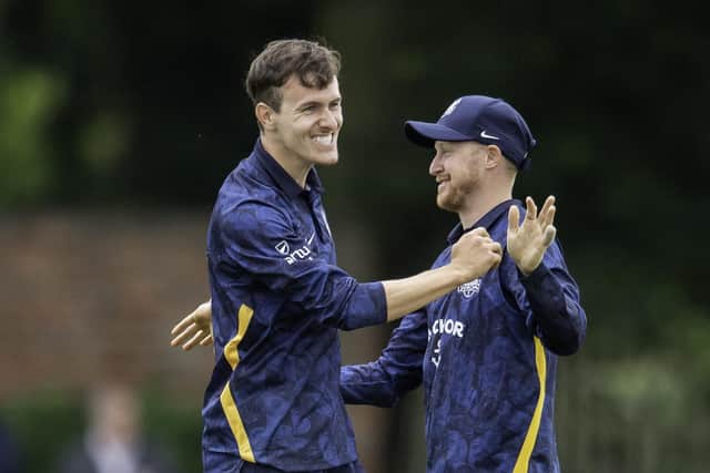 Well done: Yorkshire's Josh Sullivan is congratulated by Jack Tattersall on dismissing Nottinghamshire's Liam Patterson-White.