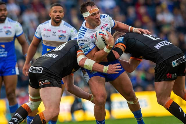 Bodene Thompson is held by the Castleford Tigers defence.
Picture: Bruce Rollinson.