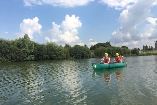 Luke Fawcett and James Penn canoeing with the Trust at Whitemoor