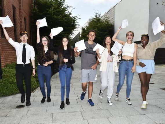 Students at Farnley Academy collecting their GCSE results. Pic: Steve Riding