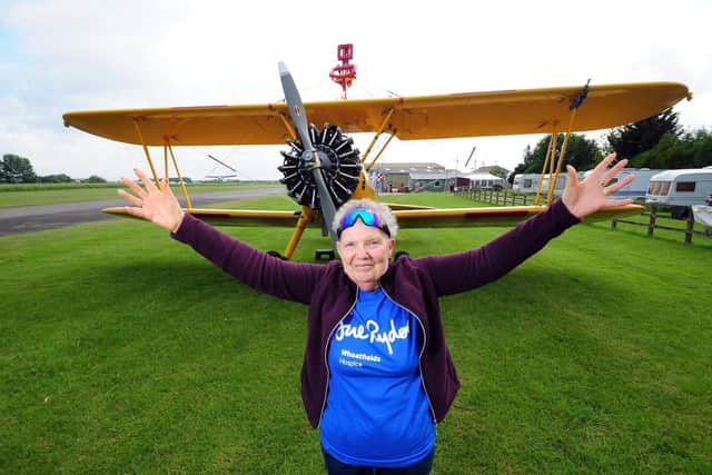 Jean Piper in June 2018 when she took part in a loop-the-loop wingwalk in aid of Sue Ryder Wheatfields Hospice in Headingley. Picture: Simon Hume