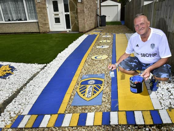 Season ticket holder Andy Lubgan has hand painted his Alwoodley garden in honour of his beloved Leeds United. Photo: Steve Riding.