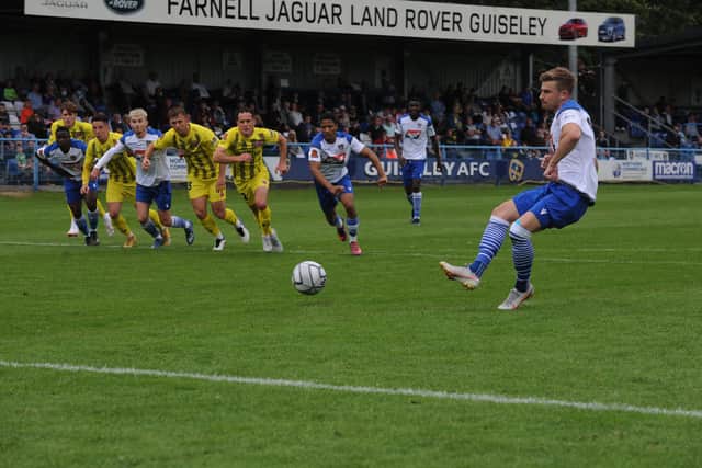 Jordan Thewlis scores from the penalty spot in Guiseley's 4-2 defeat to Fylde. Picture: Steve Riding.