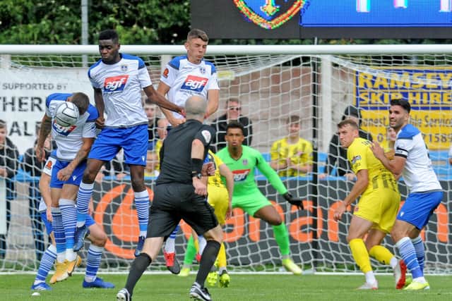 The Guiseley wall holds firm to block a Fylde free-kick. Picture: Steve Riding.