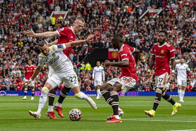 Leeds United's Jack Harrison is outnumbered by the Manchester United defence. Picture: Tony Johnson.