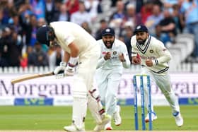 Beginning of the end: India captain Virat Kohli (right) celebrates catching out England counterpart Joe Root during England's second innings. Picture: Zac Goodwin/PA Wire.