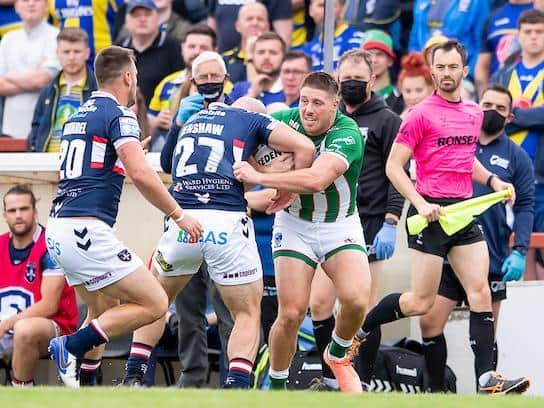 Tom Lineham is tackled by Lee Kershaw during Warrington's defeat at Wakefield last weekend. Picture by Allan McKenzie/SWpix.com.