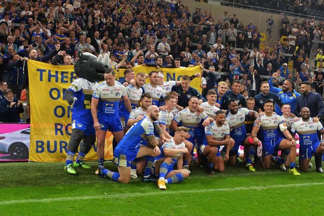Fitting tribute: Leeds Rhinos players and fans with a Rob Burrow banner at the end of last night's win.

Picture: Jonathan Gawthorpe