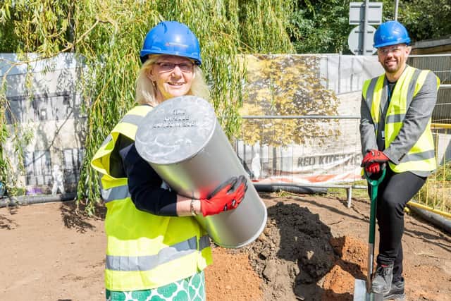 Deputy Chief Executive Dawn Hanwell and Operations Manager Nik Lee bury the time capsule at Red Kite View