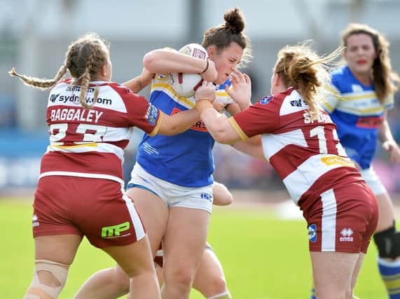 Shannon Lacey is tackled during the 2018 Super League Grand Final. Picture by Bruce Rollinson.