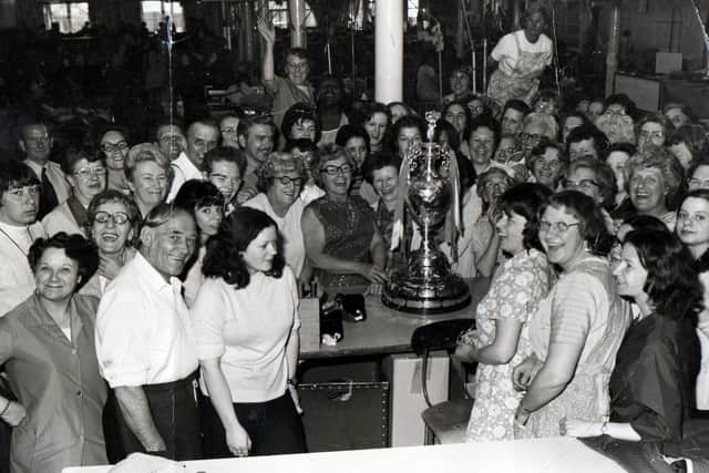 Hepworths Ltd staff with the 1974 Football League trophy. Copyright Leeds Libraries, Leodis.net