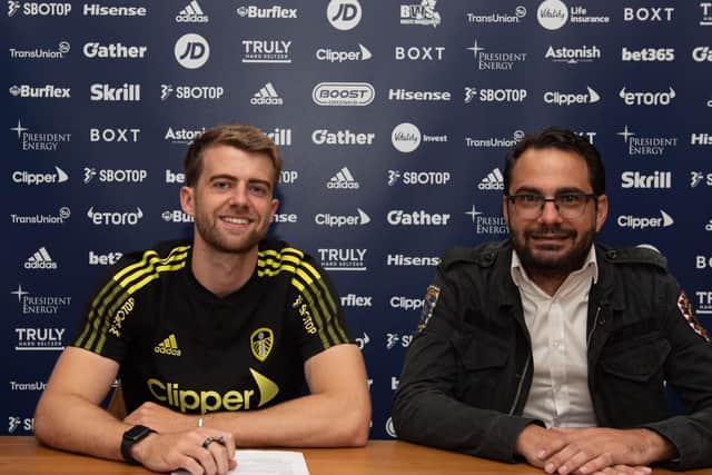 AMBITIOUS: Leeds United striker Patrick Bamford, left, with the club's director of football Victor Orta, right, after signing a new five-year deal at Elland Road. Picture by LUFC.