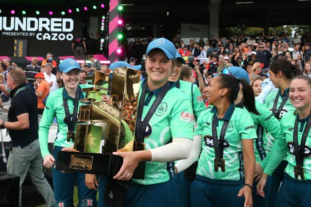 Oval Invincibles' Dane van Niekerk lifts the inaugural Hundred trophy after beating Southern Brave in the Women's Final at Lord's. Picture: Steven Paston/PA