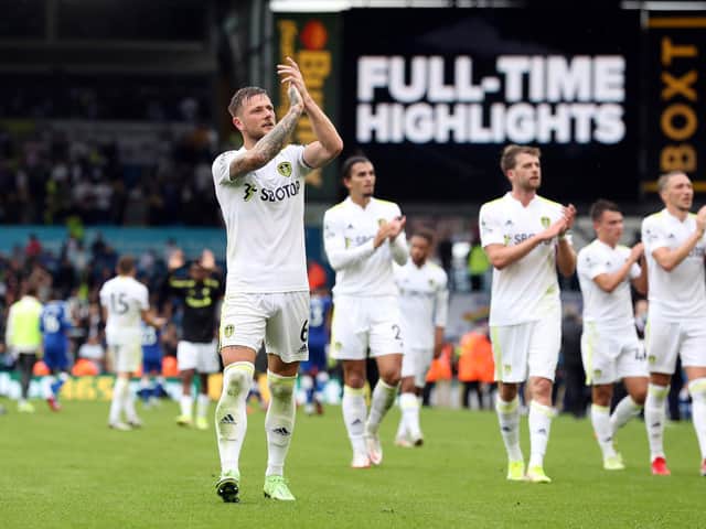 WELCOME BACK: Leeds United captain Liam Cooper leads the applause for Leeds United's fans in the Elland Road stands after Saturday's 2-2 draw against Everton. Photo by Jan Kruger/Getty Images.