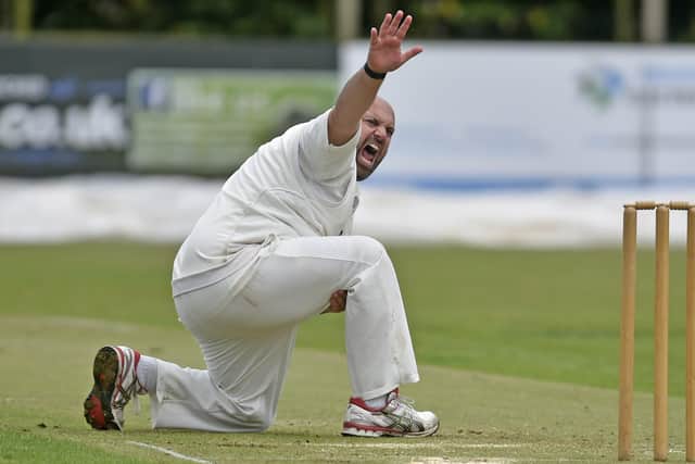 Chris Brice successfully appeals for LBW against Aaron Day of Pudsey St Lawrence to end the innings on 64. Picture: Steve Riding.