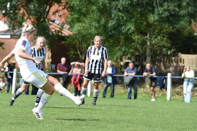 Sarah Danby gives Leeds an early lead from 12 yards.
