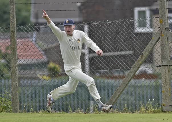 Townville fielder Charlie Sykes takes a great over his head catch to dismiss Ben Walter of East Bierley off the bowling of Ritchie Bresnan in the Priestley Cup semi-final. Picture: Steve Riding.