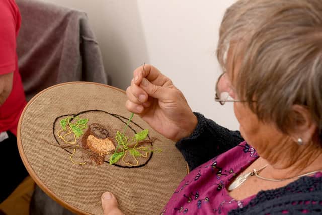 Embroidery is one of the most popular activities at the group.