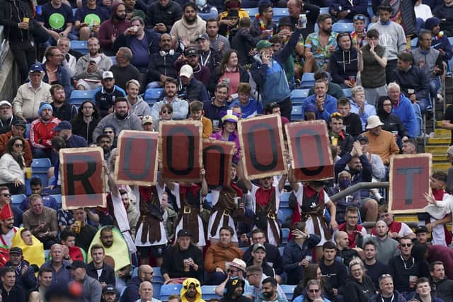 England supporters display placards as England captain Joe Root bats during the second day of third Test match. (AP Photo/Jon Super)