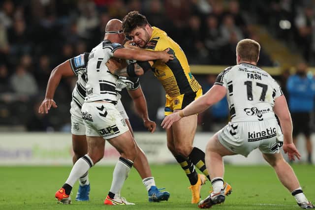 Castleford Tigers' Alex Foster battles with Hull FC's Danny Houghton. Picture by John Clifton/SWpix.com